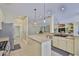 Well-lit kitchen featuring stainless steel appliances, granite countertops and ample cabinet space at 12305 Freesia Ct, Riverview, FL 33569