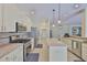 Well-equipped kitchen featuring stainless steel appliances, granite counters, and ample cabinet space at 12305 Freesia Ct, Riverview, FL 33569