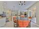Bright eat-in kitchen with stainless steel appliances opens to the living room and pool area at 12305 Freesia Ct, Riverview, FL 33569