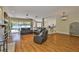 Spacious living room with hardwood floors and access to the kitchen and pool area at 12305 Freesia Ct, Riverview, FL 33569