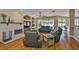 Cozy living room boasts a fireplace, wood floors, and seamless transition to the outdoor pool area at 12305 Freesia Ct, Riverview, FL 33569