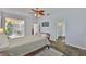 Main bedroom with en-suite bathroom access, natural light, and sliding doors to outdoor area at 12305 Freesia Ct, Riverview, FL 33569