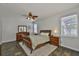 Comfortable main bedroom featuring a ceiling fan, neutral walls, and lots of natural light at 12305 Freesia Ct, Riverview, FL 33569