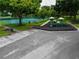Playground and tennis courts surrounded by lush greenery in a community setting at 12305 Freesia Ct, Riverview, FL 33569