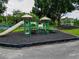 Community playground with play structures and a gazebo set among mature trees at 12305 Freesia Ct, Riverview, FL 33569