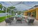 Screened-in pool with slide and outdoor seating area; perfect for entertaining at 12305 Freesia Ct, Riverview, FL 33569