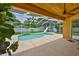 Screened-in pool with slide and beautiful tropical landscaping at 12305 Freesia Ct, Riverview, FL 33569
