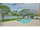 Backyard featuring a screened-in pool area with mature landscaping and privacy fence at 12305 Freesia Ct, Riverview, FL 33569