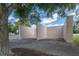Outdoor racquetball court featuring concrete walls surrounded by mature trees at 12305 Freesia Ct, Riverview, FL 33569
