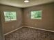 Comfortable bedroom with plush carpeting, natural light, and neutral paint at 2152 Mckinley St, Clearwater, FL 33765