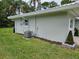 Well-maintained home exterior featuring a lush green lawn and functional features at 2152 Mckinley St, Clearwater, FL 33765