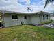 The home showcases a lush green lawn, creating a serene and inviting outdoor space at 2152 Mckinley St, Clearwater, FL 33765