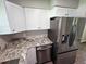 Spacious kitchen with stainless steel appliances, granite counters, and ample cabinet space at 2152 Mckinley St, Clearwater, FL 33765