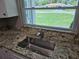 Kitchen sink with stainless fixtures set in granite countertops, looking out to a picturesque view at 2152 Mckinley St, Clearwater, FL 33765