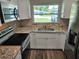 Modern kitchen with stainless steel appliances, sleek countertops, and ample cabinet space at 2152 Mckinley St, Clearwater, FL 33765