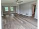 Open living room with hardwood floors, natural light, and a ceiling fan at 2152 Mckinley St, Clearwater, FL 33765