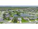 Amazing aerial view of lakefront homes surrounded by verdant trees and landscaping at 2226 Charleston Park Dr, North Port, FL 34287