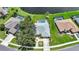 Attractive aerial view showcasing lakefront property with lush green lawns at 2226 Charleston Park Dr, North Port, FL 34287