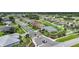 Residential street aerial view featuring manicured lawns and attractive homes in a Gathering-friendly neighborhood at 2226 Charleston Park Dr, North Port, FL 34287