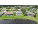 Beautiful aerial view of homes with screened in pools and lake views at 2226 Charleston Park Dr, North Port, FL 34287