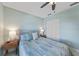 Comfortable bedroom featuring a full bed, matching nightstands, ceiling fan, and closet at 2226 Charleston Park Dr, North Port, FL 34287