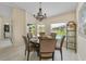 Elegant dining area with a chandelier and picturesque views of the pool area at 2226 Charleston Park Dr, North Port, FL 34287