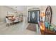 Elegant dining room with a chandelier, large window, and views of the front door entryway at 2226 Charleston Park Dr, North Port, FL 34287