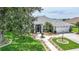 Inviting single-story home features a walkway, lush lawn, and a well-maintained exterior at 2226 Charleston Park Dr, North Port, FL 34287