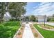 Charming single-story home with a well-manicured lawn, inviting walkway, and attached garage at 2226 Charleston Park Dr, North Port, FL 34287