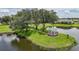 Scenic community gazebo on a small island offering a peaceful setting by the water at 2226 Charleston Park Dr, North Port, FL 34287
