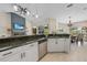 Bright kitchen showcasing granite countertops, stainless steel appliances, and an open layout at 2226 Charleston Park Dr, North Port, FL 34287