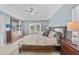 Serene main bedroom with a king-size bed, soft colors, and access to outdoor space at 2226 Charleston Park Dr, North Port, FL 34287