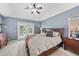 Comfortable main bedroom featuring a king-size bed, soothing colors, and natural light at 2226 Charleston Park Dr, North Port, FL 34287