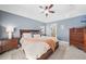 Inviting main bedroom with a spacious layout, king bed, and views to the ensuite bathroom at 2226 Charleston Park Dr, North Port, FL 34287