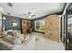 Comfortable home office with natural light, neutral furnishings, and backyard views at 2226 Charleston Park Dr, North Port, FL 34287