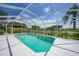 Bright screened pool area with lush landscaping, offering a private and serene outdoor space at 2226 Charleston Park Dr, North Port, FL 34287