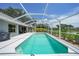 Inviting screened pool with a spacious deck, perfect for outdoor entertaining and relaxation at 2226 Charleston Park Dr, North Port, FL 34287