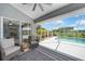 Relaxing screened lanai with comfortable seating overlooking a sparkling pool and lush landscaping at 2226 Charleston Park Dr, North Port, FL 34287