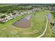 Stunning aerial view of homes bordering a picturesque golf course and pond community at 23346 Abercorn Ln, Land O Lakes, FL 34639