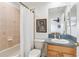 Bathroom with shower and oak vanity with view of the bedroom at 23346 Abercorn Ln, Land O Lakes, FL 34639