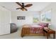 This bedroom features a ceiling fan, a window and a bean bag chair at 23346 Abercorn Ln, Land O Lakes, FL 34639