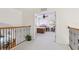 Upstairs view to bedroom with ceiling fan, and brown and red bedding at 23346 Abercorn Ln, Land O Lakes, FL 34639