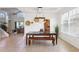 Dining area featuring tile floors, a modern chandelier, and views of the open floor plan at 23346 Abercorn Ln, Land O Lakes, FL 34639