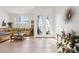 Bright foyer with tiled floors, glass front doors, and ample natural light from the large windows at 23346 Abercorn Ln, Land O Lakes, FL 34639