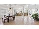 Open concept living space with high ceilings, tile floors, and a view of the elegant front entry at 23346 Abercorn Ln, Land O Lakes, FL 34639