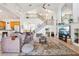 Spacious living room with a staircase, high ceilings, and an entertainment center with a TV at 23346 Abercorn Ln, Land O Lakes, FL 34639