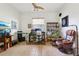 Inviting office space with tile floors, ceiling fan, desk and shelving at 23346 Abercorn Ln, Land O Lakes, FL 34639