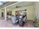 The covered patio is fully furnished and provides access to the pool at 23346 Abercorn Ln, Land O Lakes, FL 34639