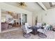 The covered patio is fully furnished and provides access to the home's interior at 23346 Abercorn Ln, Land O Lakes, FL 34639