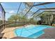 The screened in pool area includes a water feature and brick paver decking at 23346 Abercorn Ln, Land O Lakes, FL 34639